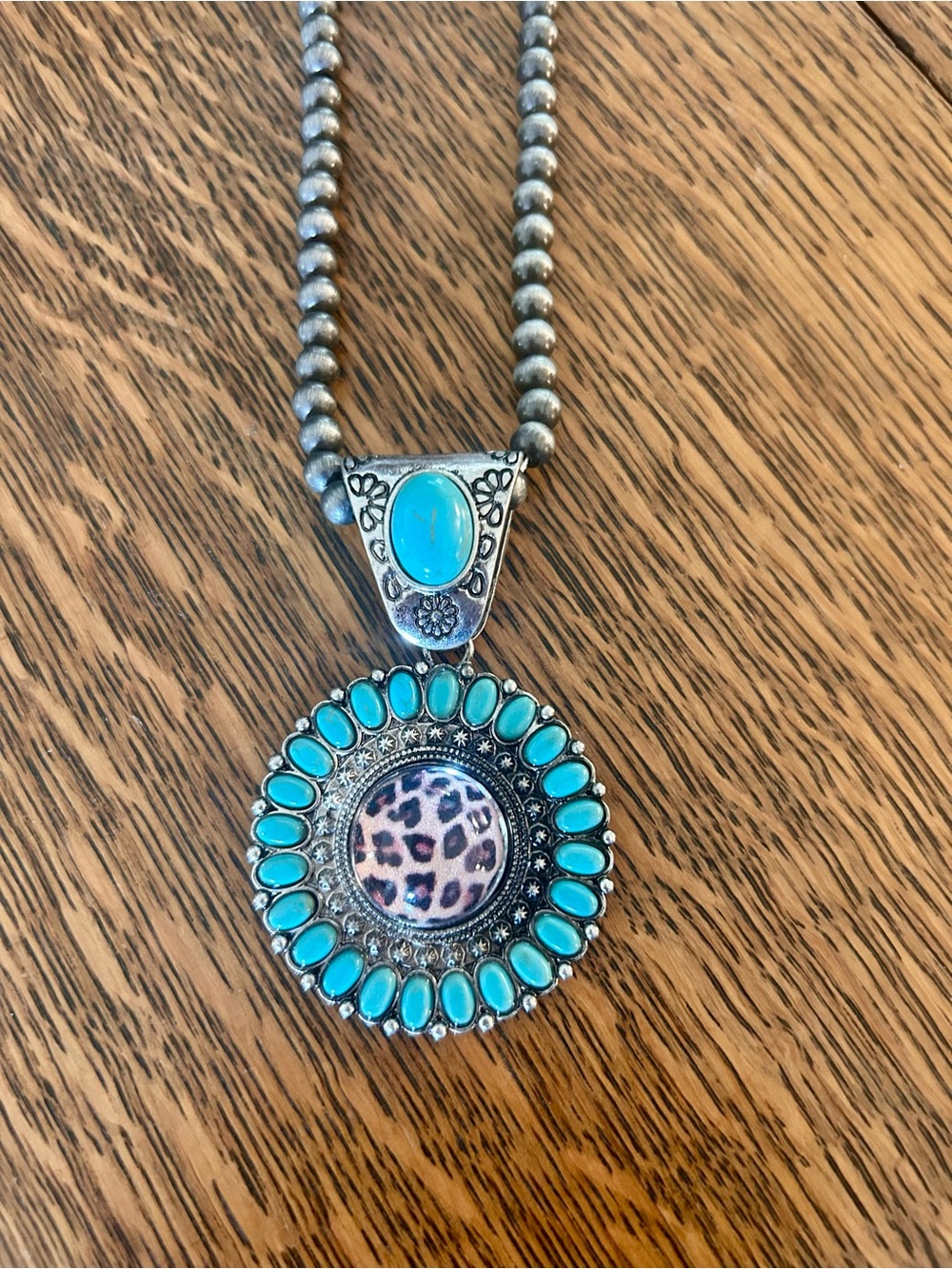 Turquoise Accent Circular Pendant Necklace with Leopard Motif